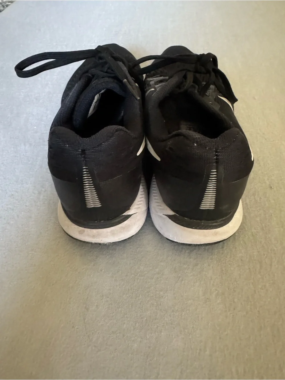 Nike Black Athletic Running Shoes with White Swoosh
